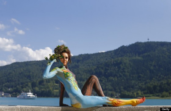 A participant poses with her body painti