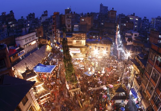 Devotees gather around the chariot of Seto Machindranath during the Seto Machindranath chariot festival at Ashon in Kathmandu